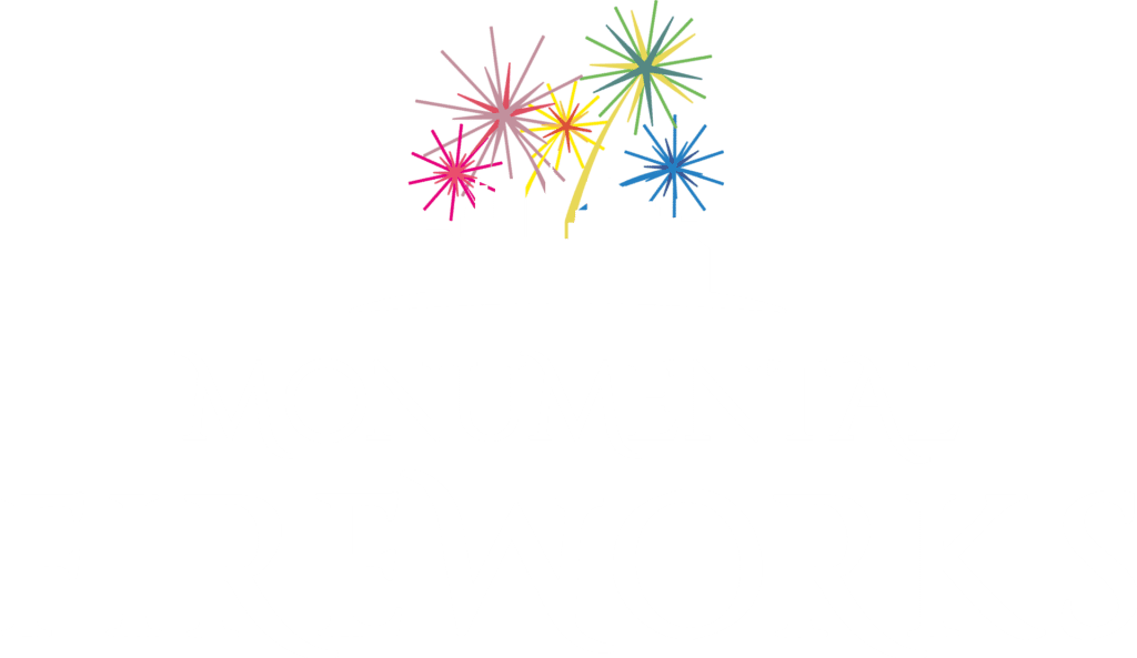 Monumental Fireworks logo with silhouette of buildings and colorful fireworks above.